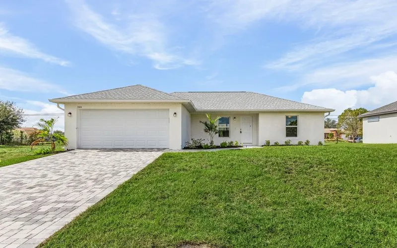 Completed single-story build-to-rent home at 1404 NE 13th Ave, Cape Coral